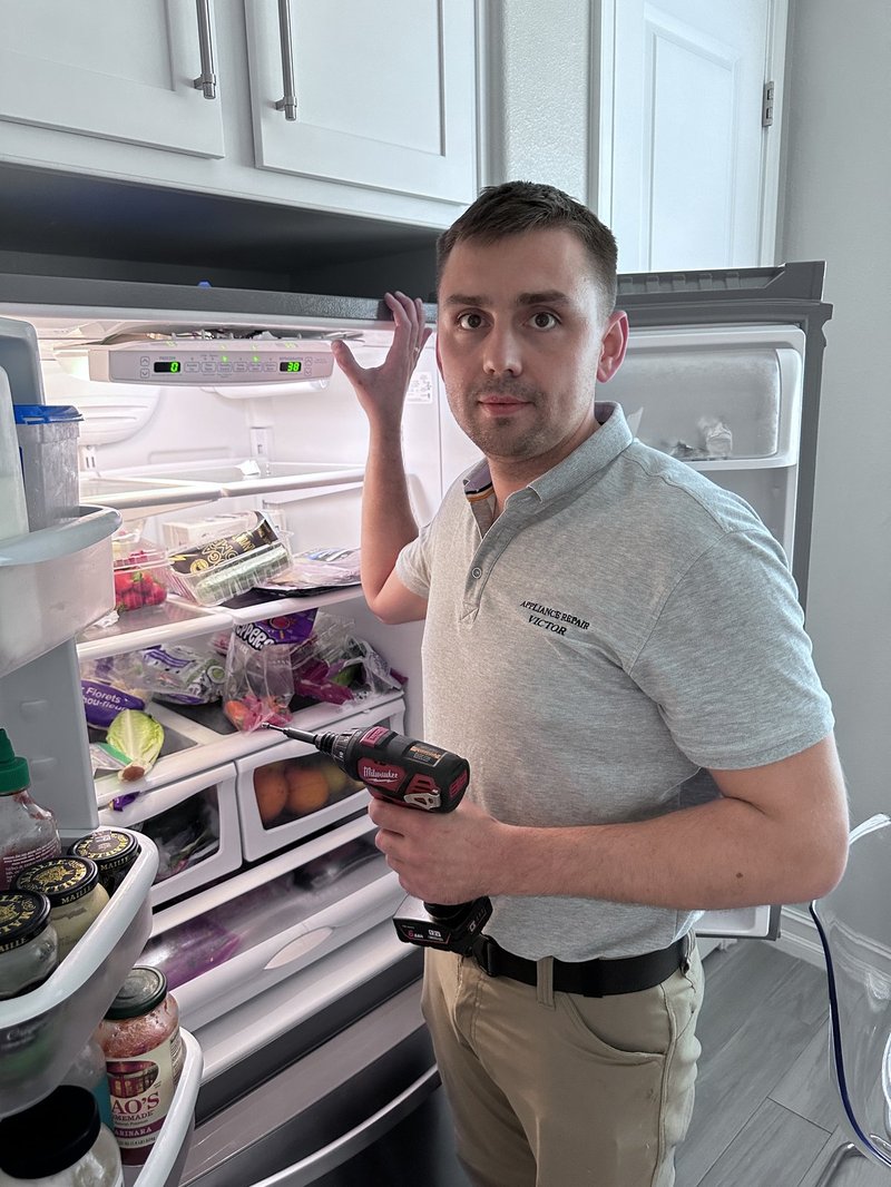 Technician examining an appliance