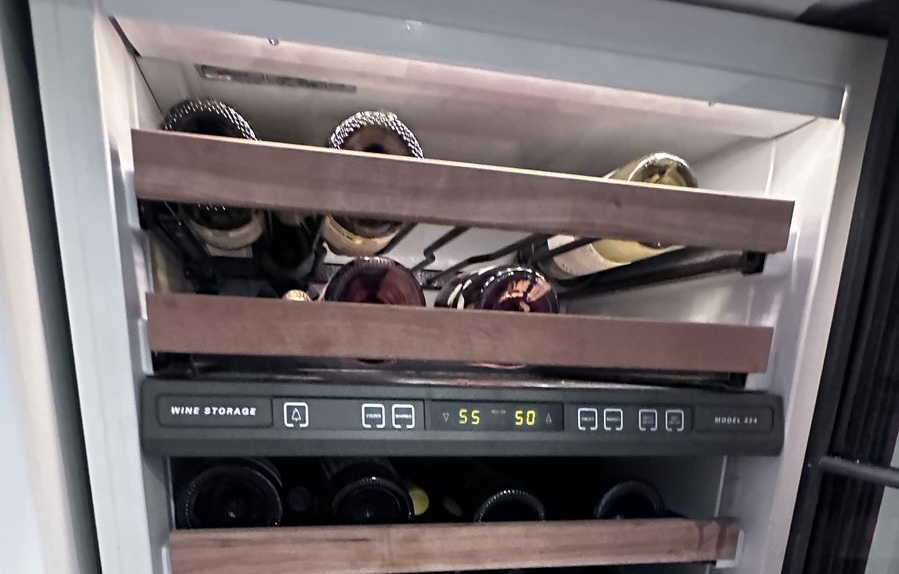 Easy Appliances Repair technician servicing a wine cooler in a Denver home